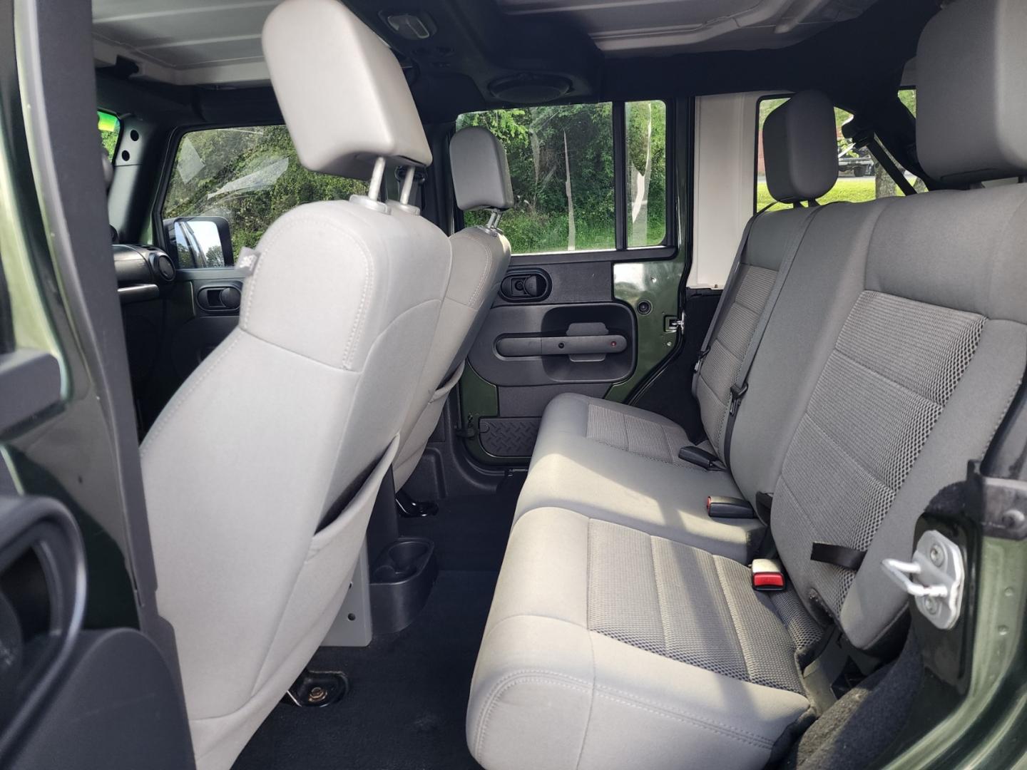 2008 Green /Black Jeep Wrangler Unlimited Rubicon (1J4GA69158L) with an 3.8L V6 OHV 12V engine, Automatic transmission, located at 1221 Madison St., Shelbyville, TN, 37160, (931) 680-9439, 0.000000, 0.000000 - Photo#3